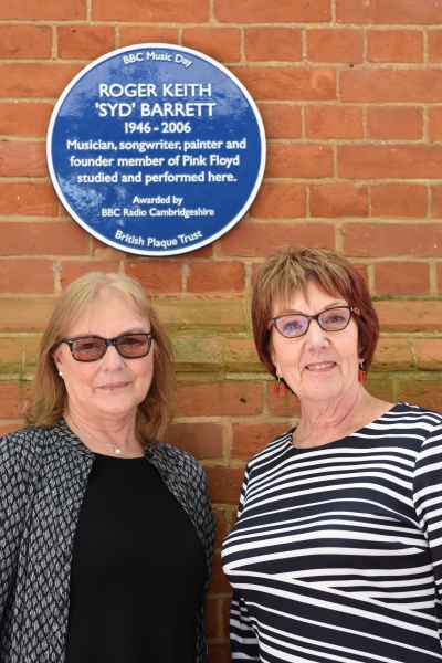 Jenny Spires (L) and Rosemary Breen (R) stand underneath Syd Barrett's Blue Plaque