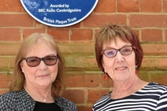 Jenny Spires (L) and Rosemary Breen (R) stand underneath Syd Barrett's Blue Plaque